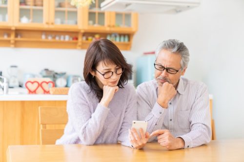 senior age couple using a smart phone, trouble asian senior age couple using a smart phone, trouble