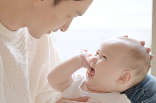 young asian father enjoying with baby young asian father enjoying with baby